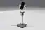 Render of the phone stand: a weighted base, an aluminium post, and a white pan/tilt yoke holding the phone in portrait