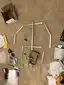 Aluminum extrusion segments laid out on carpet in a humanoid body shape Aluminum extrusion segments laid out on carpet in a humanoid body shape