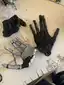 Glove-based hand prototype with taped finger segments on a workbench Glove-based hand prototype with taped finger segments on a workbench