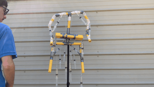 Suspended Limboid torso rig in front of a garage door Suspended Limboid torso rig in front of a garage door
