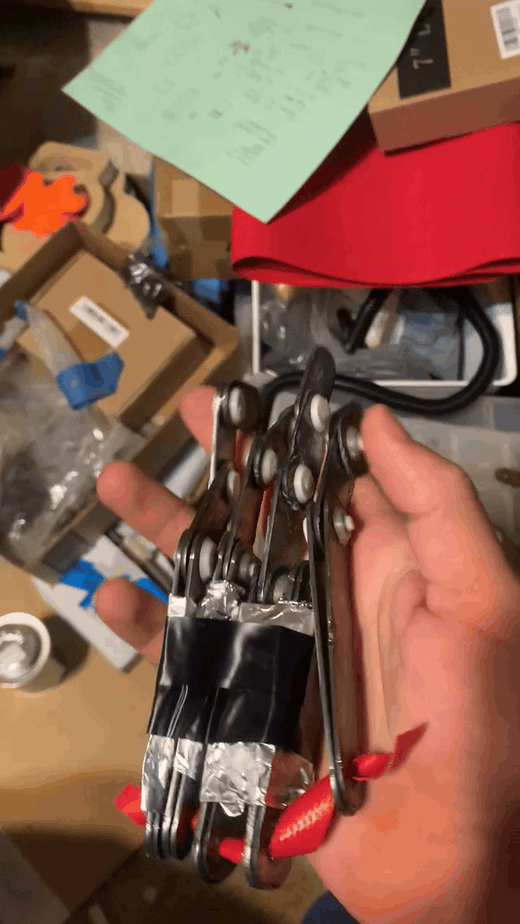 Tendon-style hand prototype moving in hand Tendon-style hand prototype moving in hand