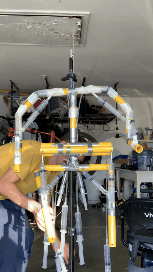 Upper-body Limboid rig being adjusted in the garage Upper-body Limboid rig being adjusted in the garage